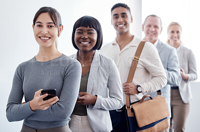 Buy stock photo Shot of a group of new employees waiting in a line to complete their interview