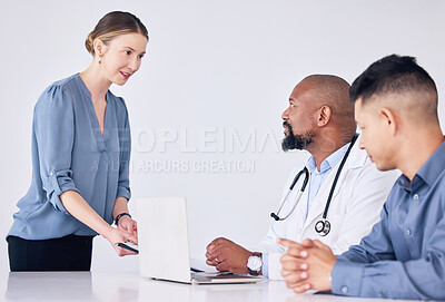 Buy stock photo Shot of a mature male doctor having a consultation with a patient at a hospital