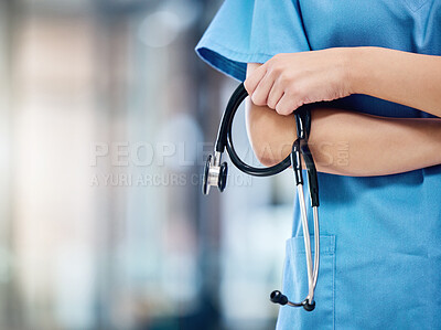 Buy stock photo Shot of an unrecognizable doctor holding a stethoscope at a hospital