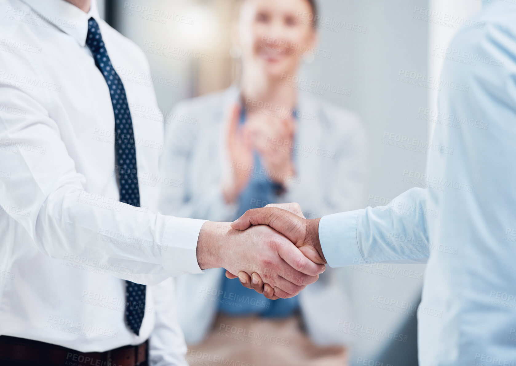 Buy stock photo Shot of two unrecognizable businesspeople shaking hands in an office at work