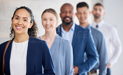 Buy stock photo Shot of a group of businesspeople standing in a line at an office