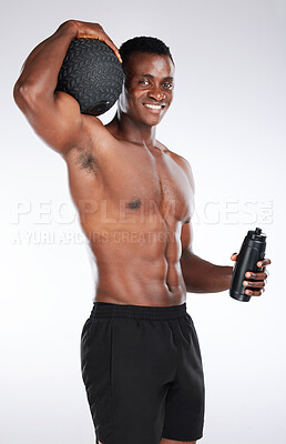 Buy stock photo Portrait, bottle and black man with ball, fitness and confident guy on white studio background. African person, bodybuilder and athlete with pride, confidence and aesthetic with power and training