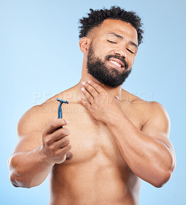 Buy stock photo Man, razor and doubt in studio for grooming, hair removal and facial transformation choice. Male person, blade tool and thinking of epilation, skin irritation and product issue on blue background