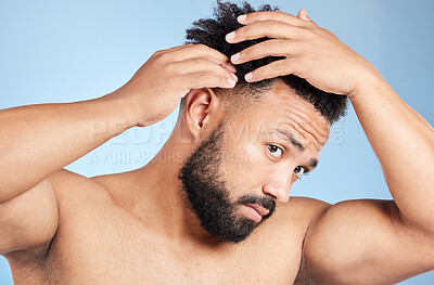 Buy stock photo Beauty, touch and black man in studio for hair, cleaning or morning routine isolated on blue background. Hairstyle cosmetics and grooming of model at barber to check scalp for dandruff treatment