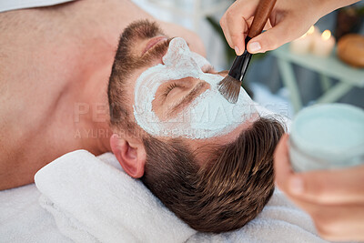 Buy stock photo Shot of a young man enjoying a relaxing facial at a spa