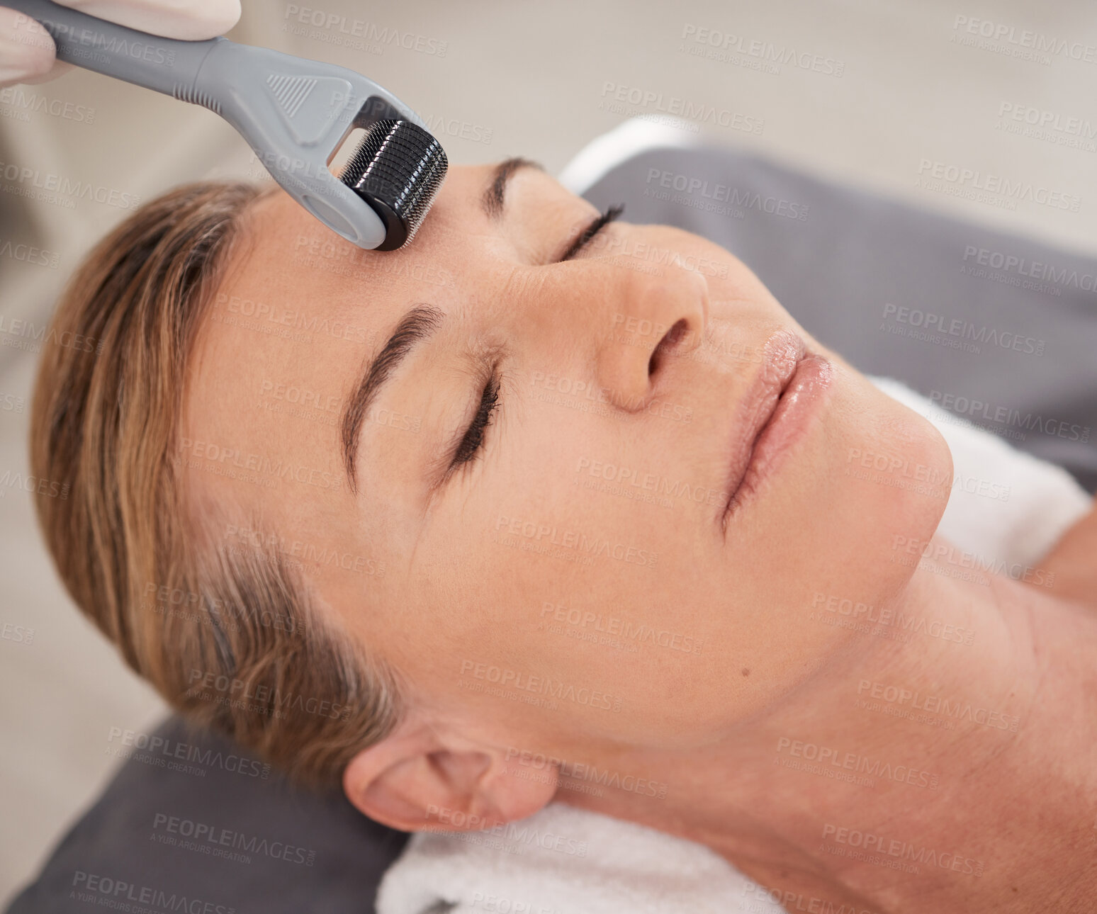 Buy stock photo Woman, face and needle with derma roller for beauty, skincare or microneedling at spa. Closeup of female person, relaxation or sleeping with tool for facial massage in cosmetology at salon or resort