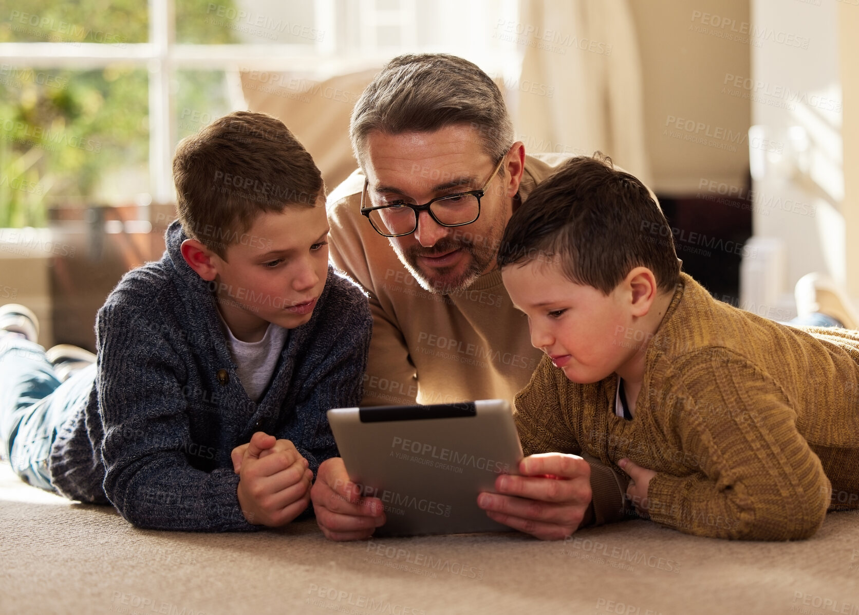 Buy stock photo House, father and boy on floor, tablet and bonding together with happiness, connection and social media. Single parent, dad or sons on ground, tech or digital app with internet, website info or relax