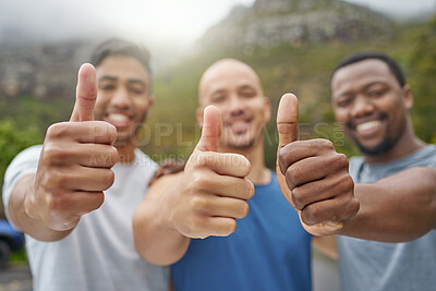 Buy stock photo Closeup shot of a group of unrecognisable men showing thumbs up while exercising outdoors