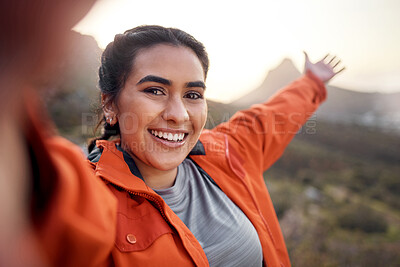 Buy stock photo Cropped portrait of an attractive young woman taking selfies while hiking in the mountains