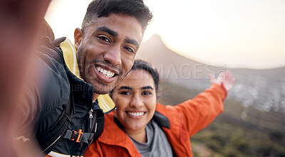 Buy stock photo Cropped portrait of an affectionate young couple taking selfies while hiking in the mountains