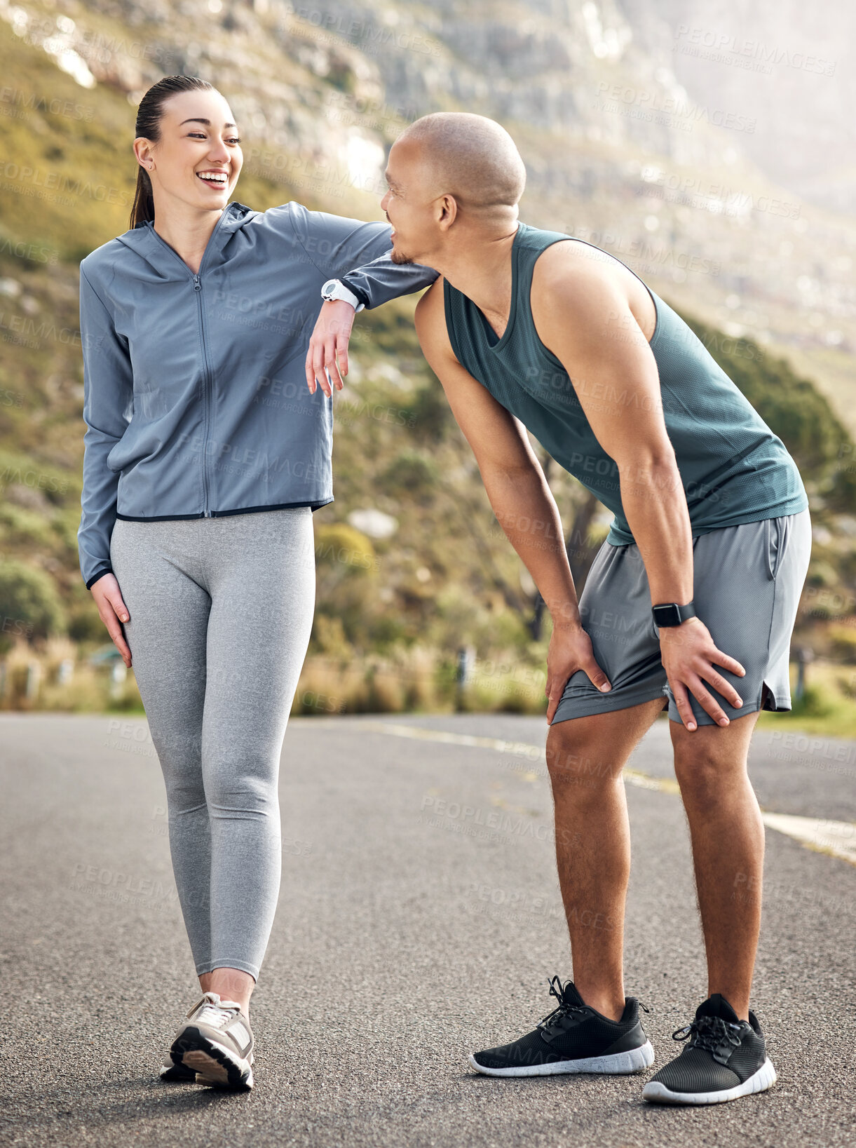 Buy stock photo Shot of a couple out for a run on a mountain road