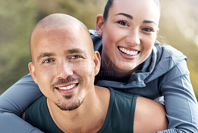 Buy stock photo Shot of a man carrying his girlfriend on his back while out for a workout