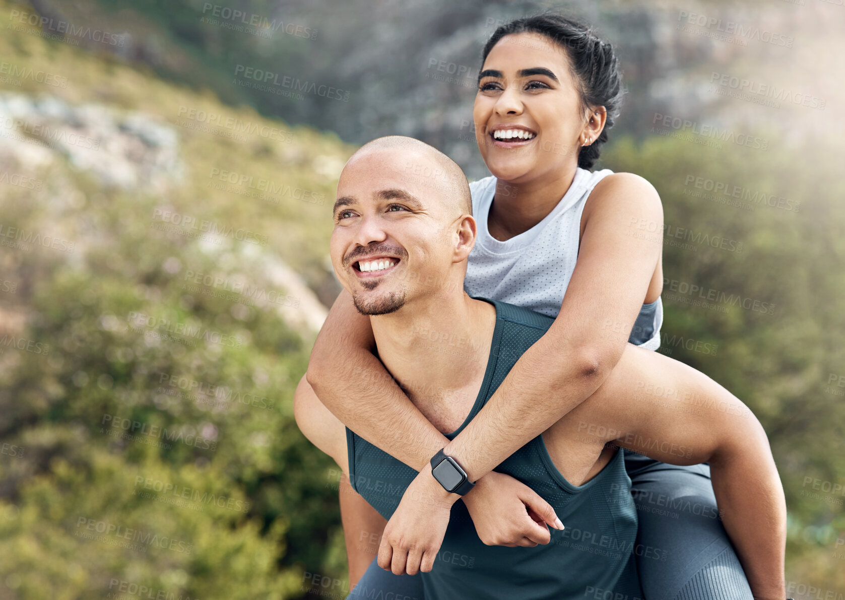 Buy stock photo Shot of a man carrying his girlfriend on his back while out for a workout