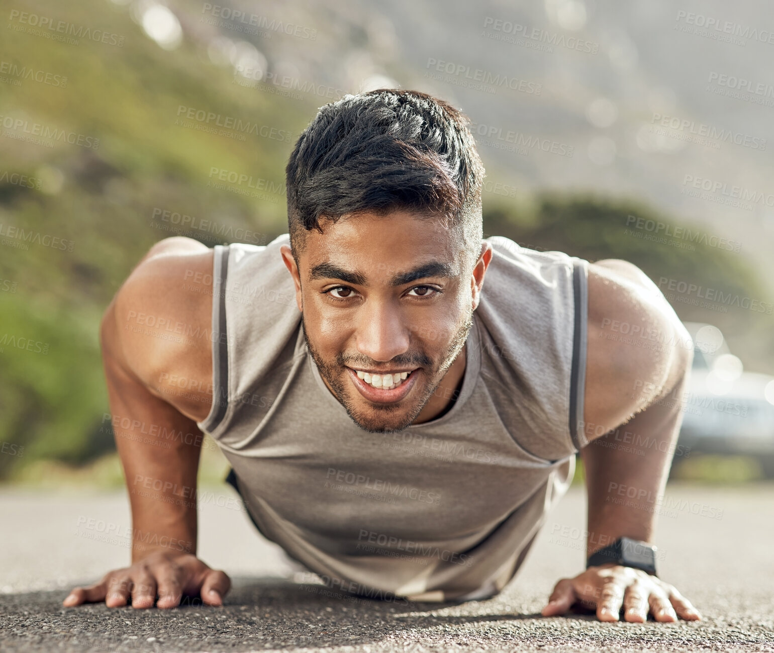 Buy stock photo Shot of an athletic young man doing push-ups outside
