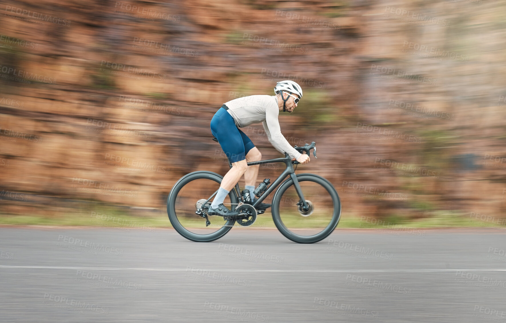 Buy stock photo Full length shot of a handsome mature man cycling outdoors