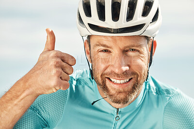 Buy stock photo Cropped portrait of a handsome mature man giving thumbs up while cycling outdoors