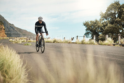 Buy stock photo Full length shot of a handsome mature man cycling outdoors