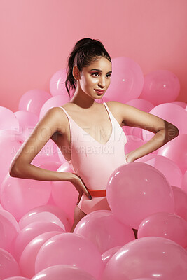 Buy stock photo Studio shot of a beautiful young woman posing with balloons