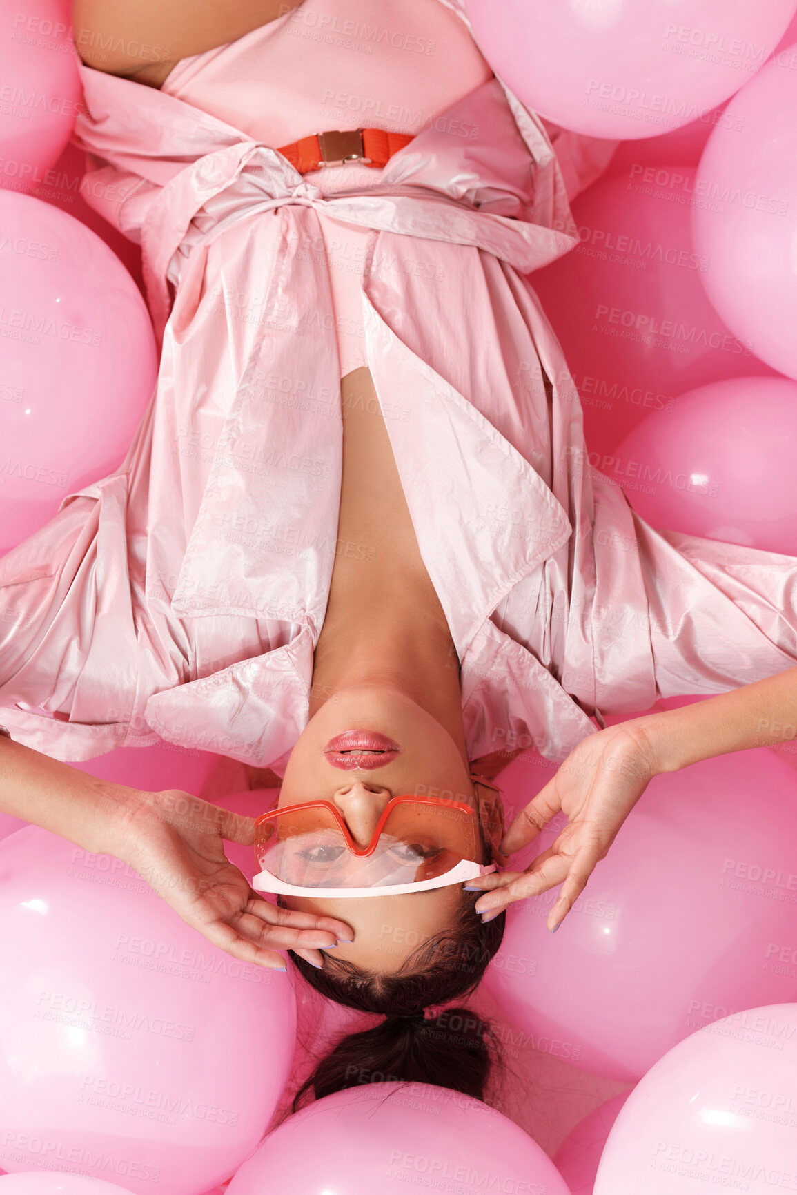 Buy stock photo Studio shot of a beautiful young woman posing with balloons