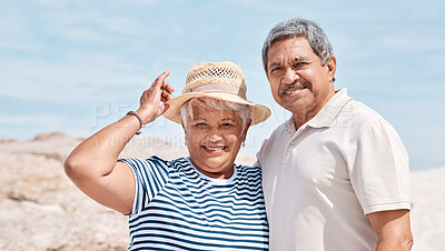 Buy stock photo Shot of a senior couple standing together on the beach