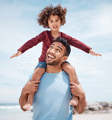 Buy stock photo Shot of a man spending time at the beach with his son