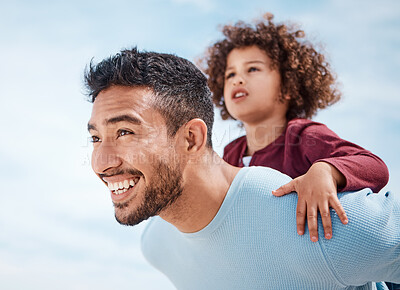 Buy stock photo Shot of a man spending time at the beach with his son