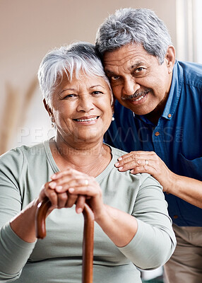 Buy stock photo Shot of a happy senior couple relaxing together at home