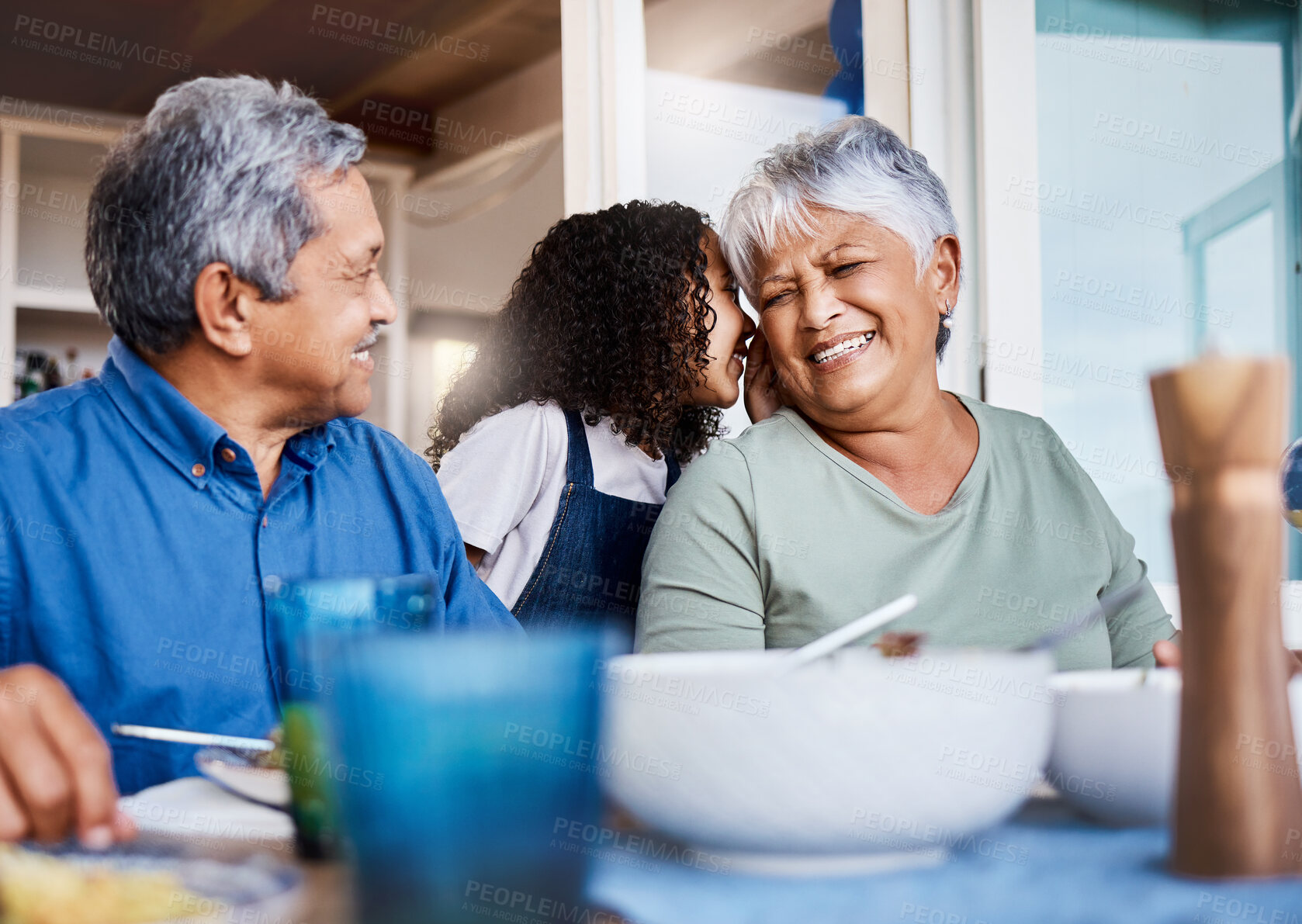 Buy stock photo Shot of a happy family having lunch together at home