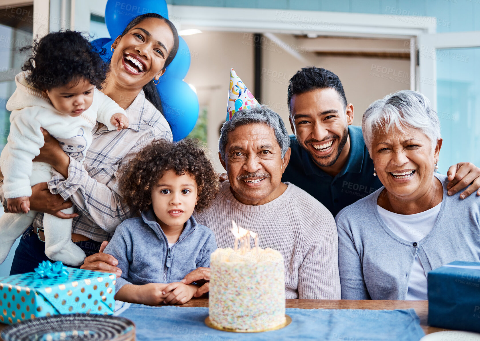 Buy stock photo Shot of a little boy celebrating his birthday with his family at home