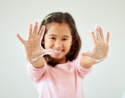 Buy stock photo Child, portrait and showing hands with soap in bathroom for hygiene, sanitation and germ removal. Happy, girl and gesture with cleaning at home for bacteria disinfection, protection and health safety