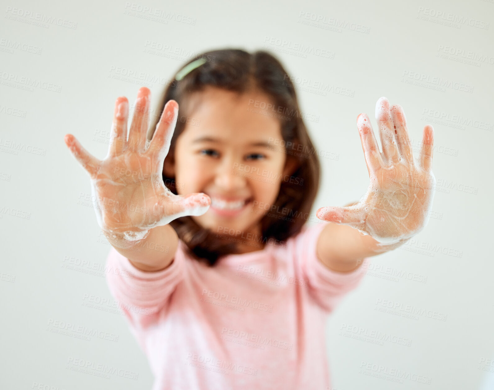 Buy stock photo Child, portrait and showing hands with soap in bathroom for hygiene, sanitation and germ removal. Happy, girl and gesture with cleaning at home for bacteria disinfection, protection and health safety