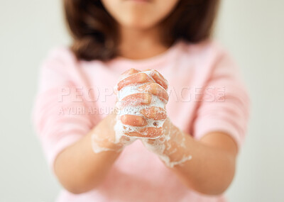 Buy stock photo Child, body and washing hands with soap in bathroom for sanitation, hygiene and germ removal. Girl, kid and cleaning with foam at home for bacteria disinfection, protection and safety of health