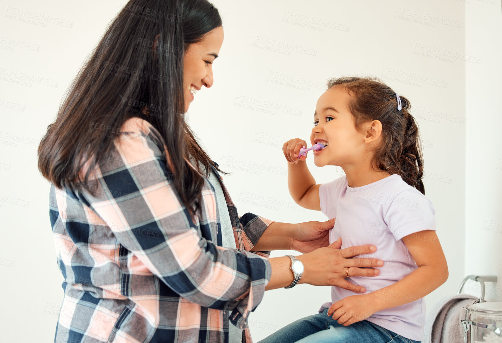 Buy stock photo Brushing teeth, cleaning and smile of mother and daughter in bathroom of home for hygiene together. Dental, love or teeth with single parent woman and girl child in apartment for morning routine