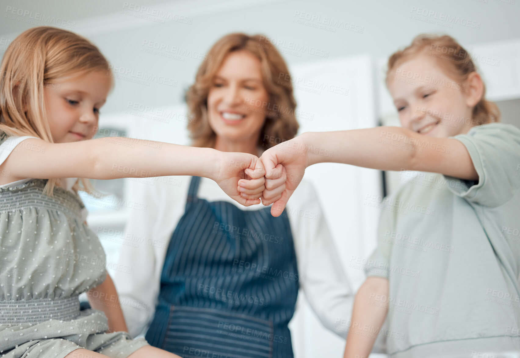 Buy stock photo Fist bump, family and children with home, kitchen and learning with ingredients for pastry or dessert cake. Happy smile, grandmother and cooking kids help baking pudding, cookies or bakery recipe