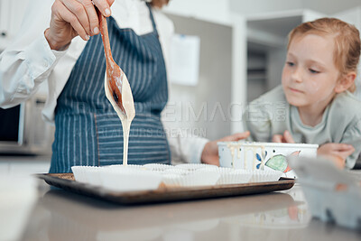 Buy stock photo Closeup shot of a grandmother baking with her granddaughter at home