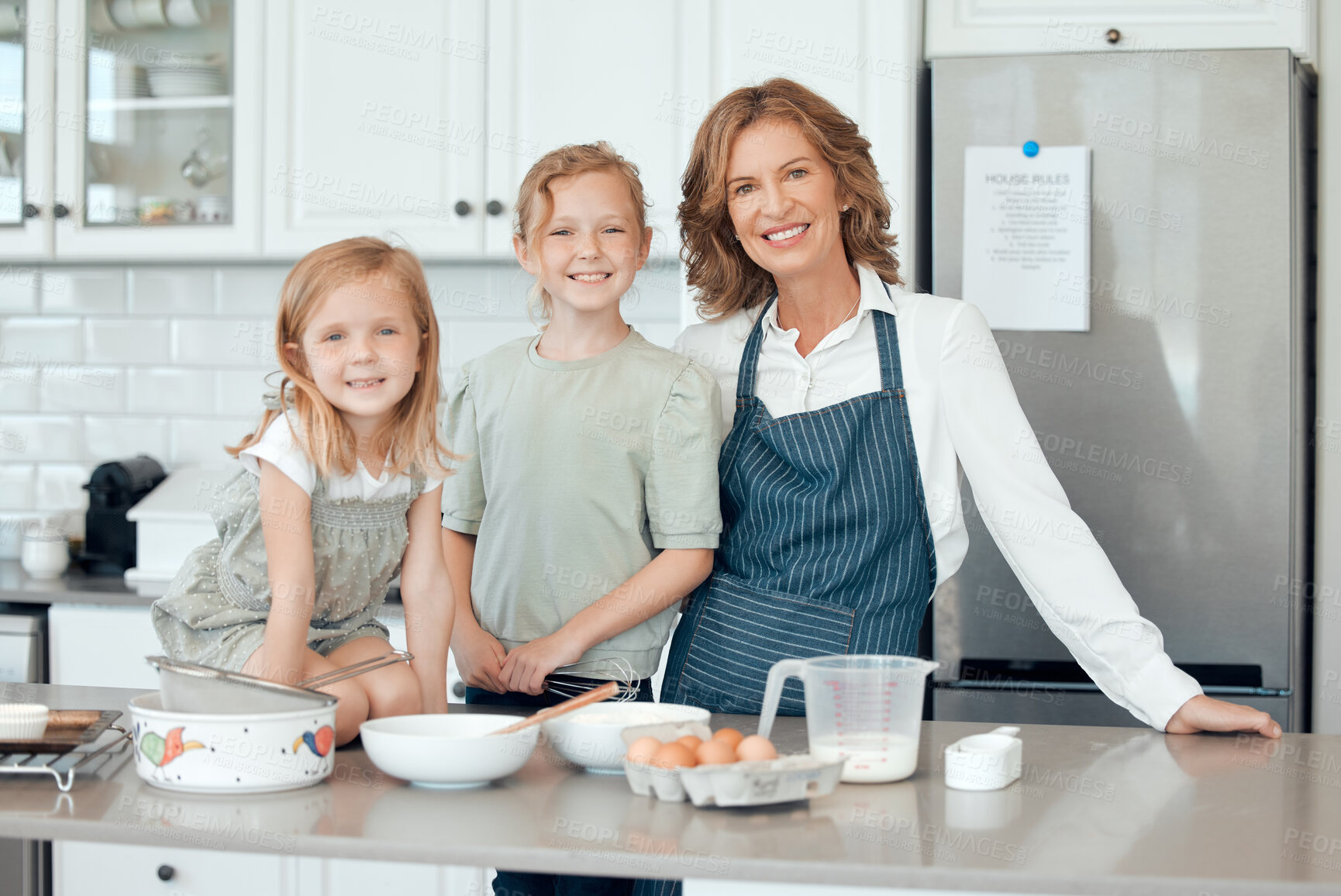 Buy stock photo Family, portrait and happy children with home, kitchen and learning with ingredients for pastry or dessert cake. Smile, grandmother and cooking kids help baking pudding, cookies or bakery recipe