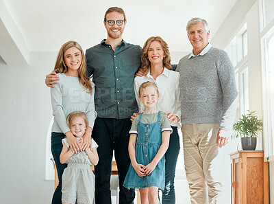 Buy stock photo Shot of a family standing together during a relaxing day at home