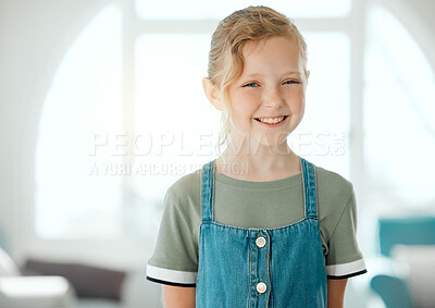 Buy stock photo Shot of an adorable little girl standing alone at home