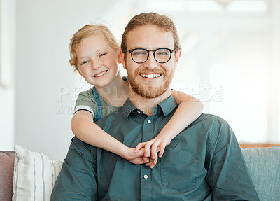 Buy stock photo Shot of an adorable little girl hugging her father during a day at home