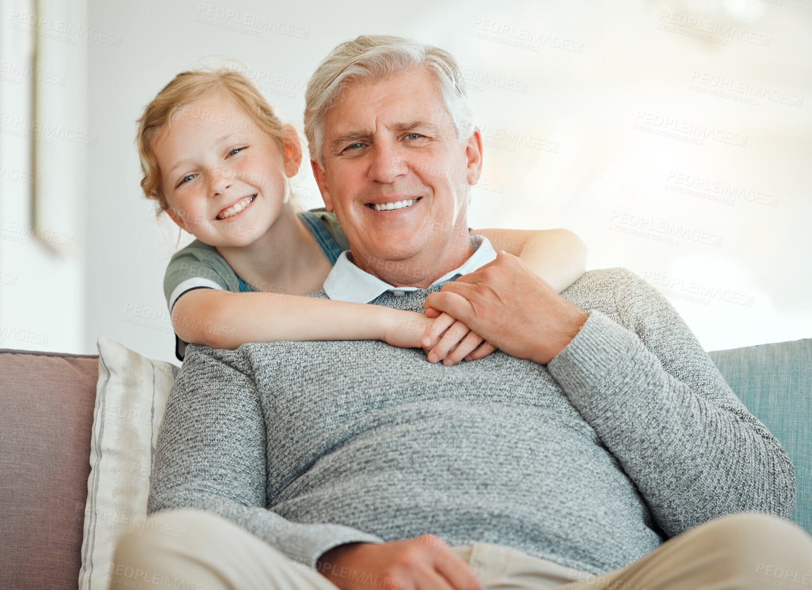 Buy stock photo Girl, grandfather and happy on sofa with portrait for bonding, care and embrace on weekend with childhood love. Grandpa, kid and smile together in family house with hug, affection and relax on couch.