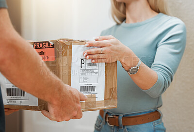 Buy stock photo Closeup shot of an unrecognisable man making a delivery to a customer at their home