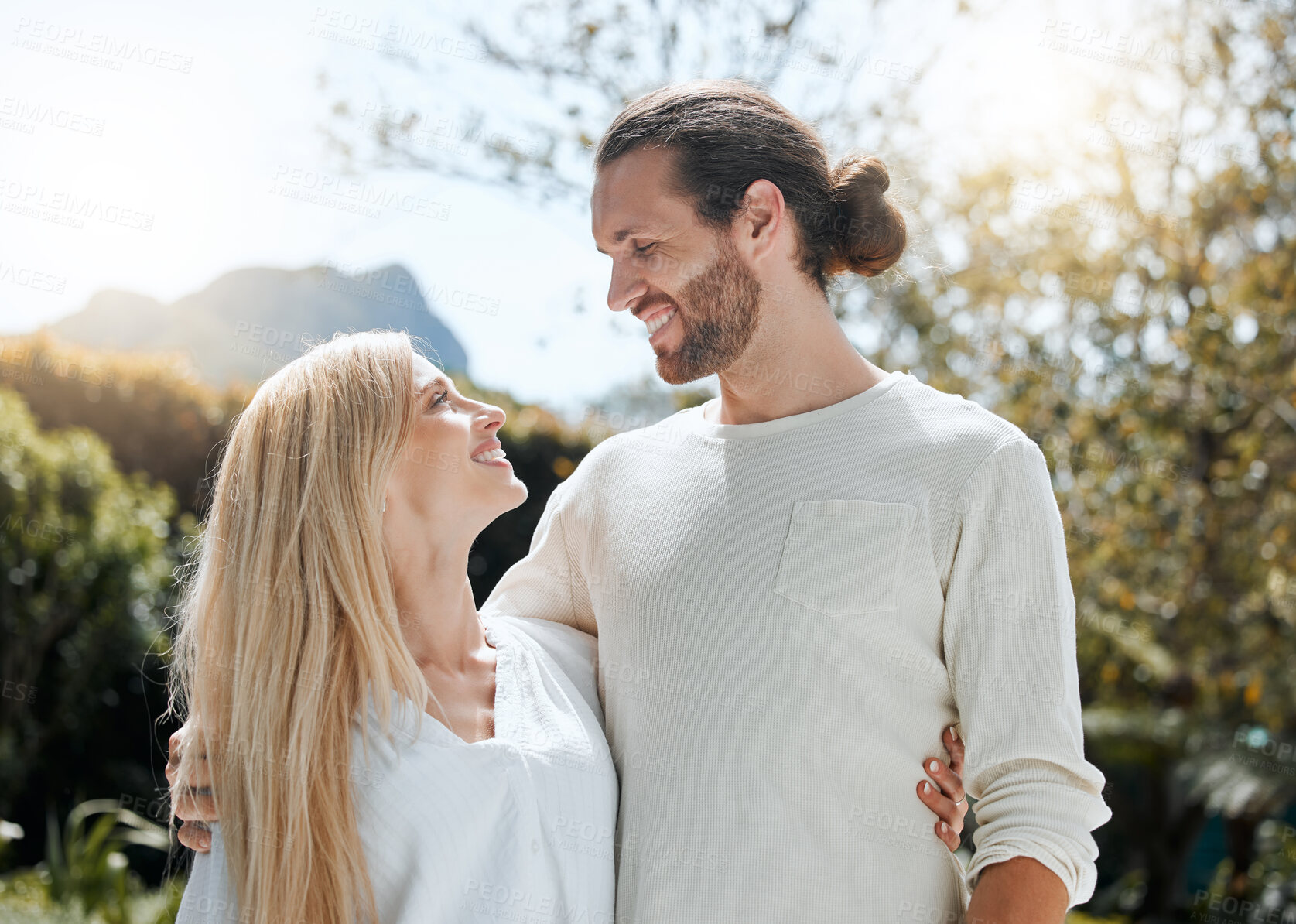 Buy stock photo Shot of an affectionate couple standing outside
