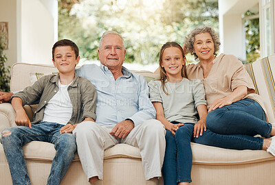 Buy stock photo Shot of a grandparents spending time with their grandchildren