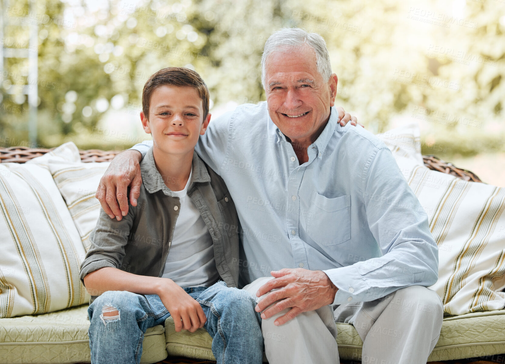 Buy stock photo Grandfather, boy and happy in patio on sofa at home for bonding, support and care in England. People, family and outside with smile on portrait on visit as babysitter for break, relax and rest