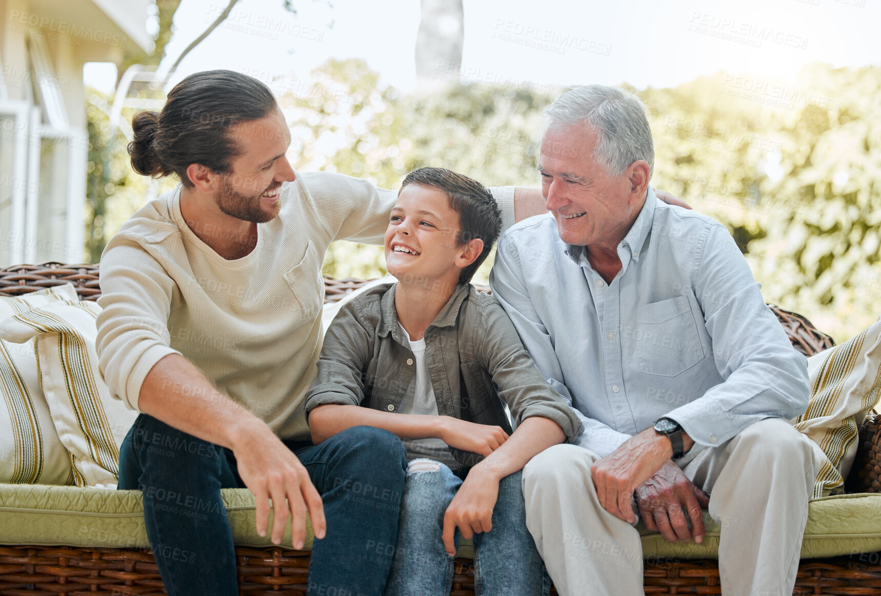 Buy stock photo Family, men or child on sofa for generations, love or visit to retirement home with smile. Grandpa, dad or son on patio couch for weekend relax, joking or happy for storytelling with laugh or fun