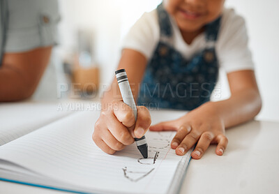 Buy stock photo Shot of a little girl doing her homework at home