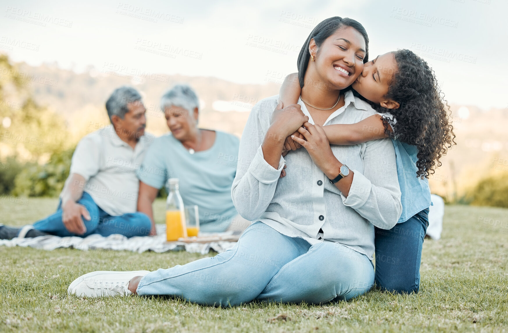 Buy stock photo Shot of a mother and daughter enjoying a day out at a picnic