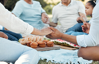 Buy stock photo Shot of a unrecognizable family having lunch together outside in the garden