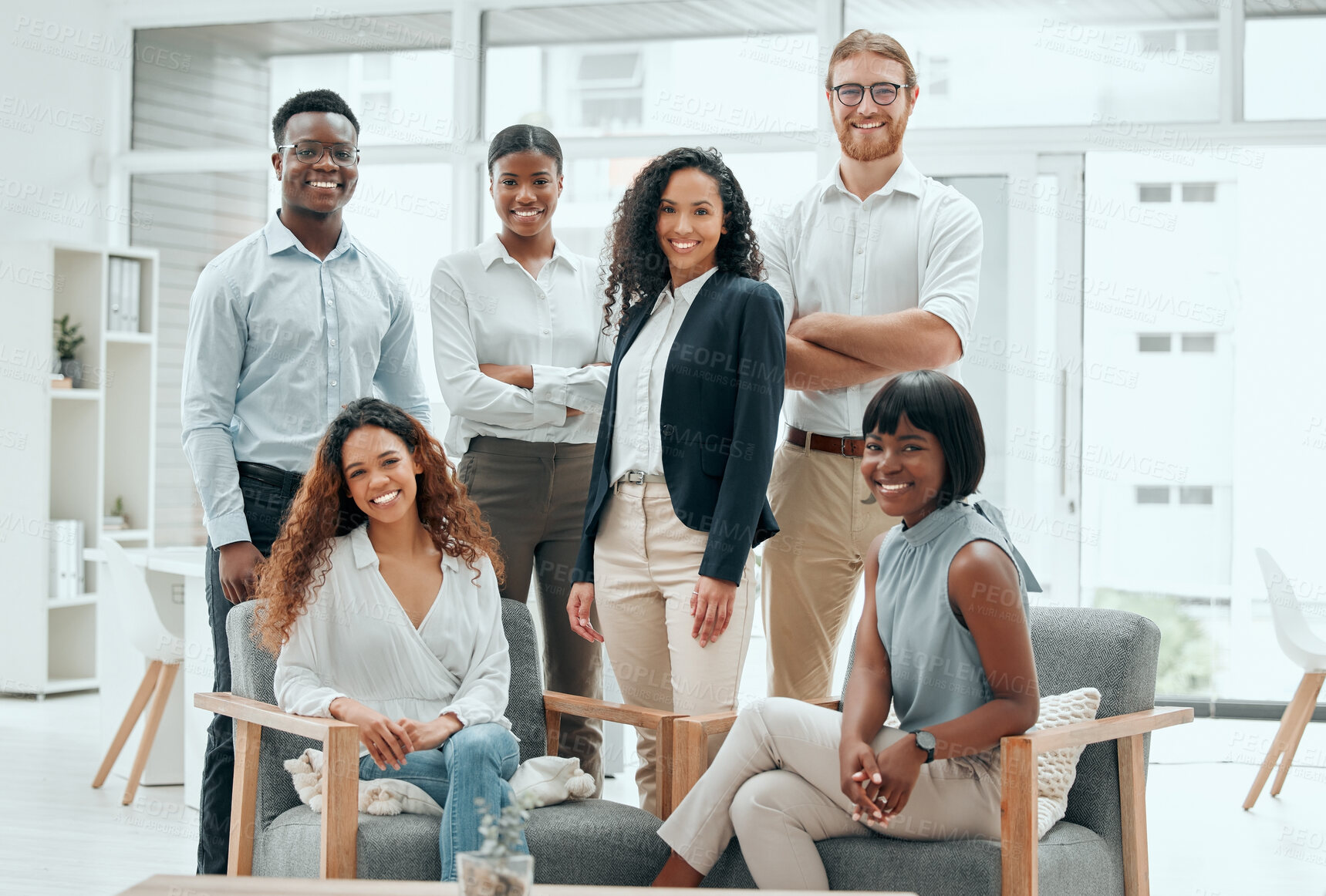 Buy stock photo Cropped portrait of a diverse group of young businesspeople posing in the office