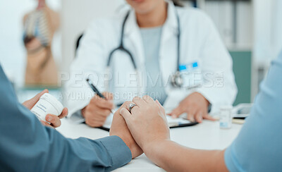 Buy stock photo Shot of a unrecognizable couple consulting with a doctor at a clinic